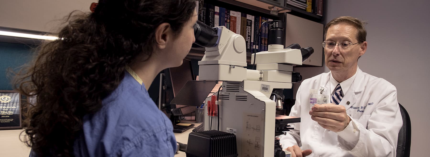 Pathologists examine specimens